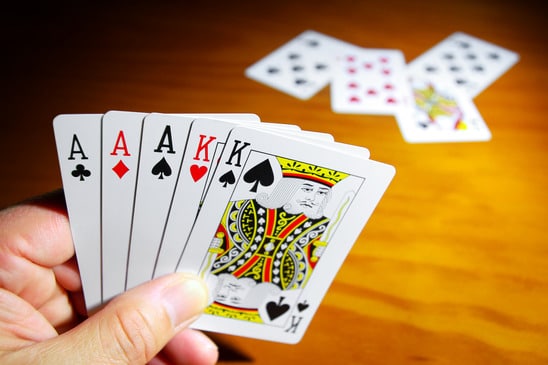 Hand of cards - - image licensed from Photodune