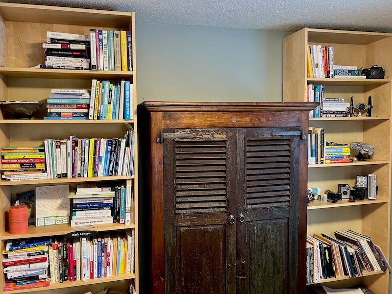 Shelves of books relevant to Agile Coaching. Maybe even the Tie Fighter is relevant