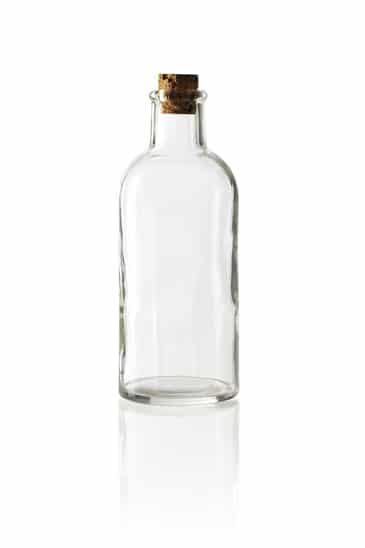 Old fashioned glass bottle with cork stopper. - image licensed from Photodune