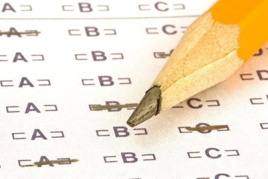 a pencil sitting on a test bubble sheet - image licensed from Photodune