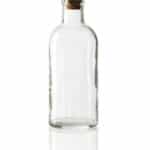 Old fashioned glass bottle with cork stopper. - image licensed from Photodune